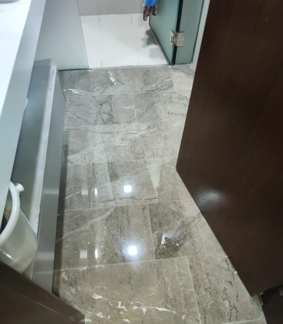 Polished marble floor at a bathroom entrance