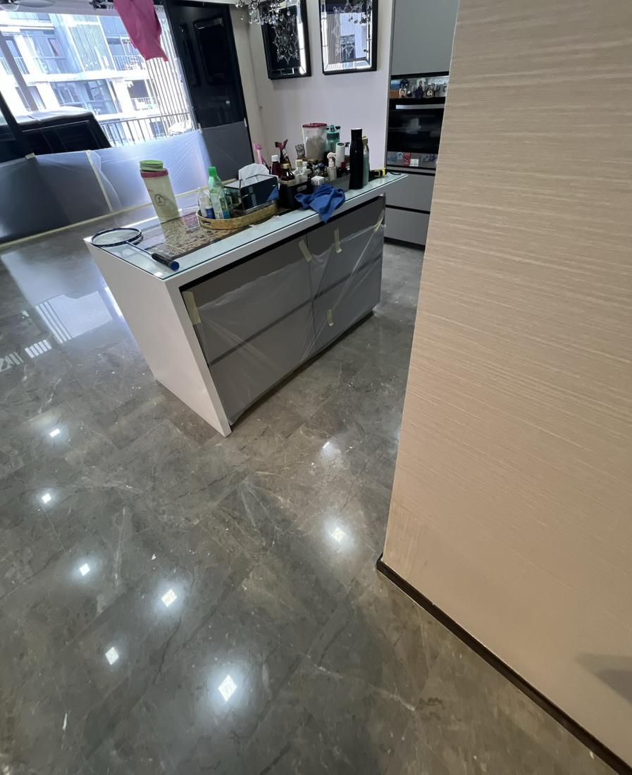 Grey marble kitchen and dining floor after polishing