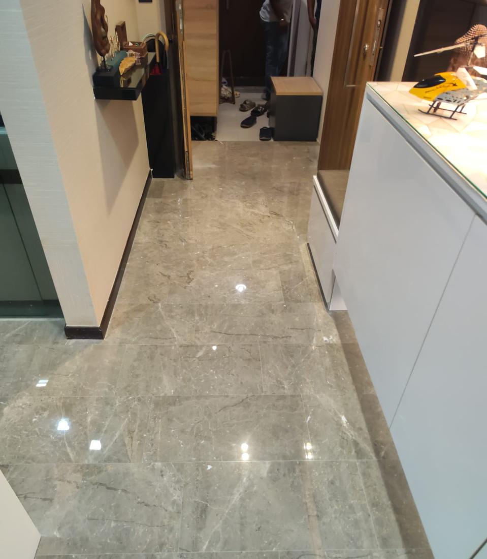 Polished grey marble walkway beside a kitchen counter