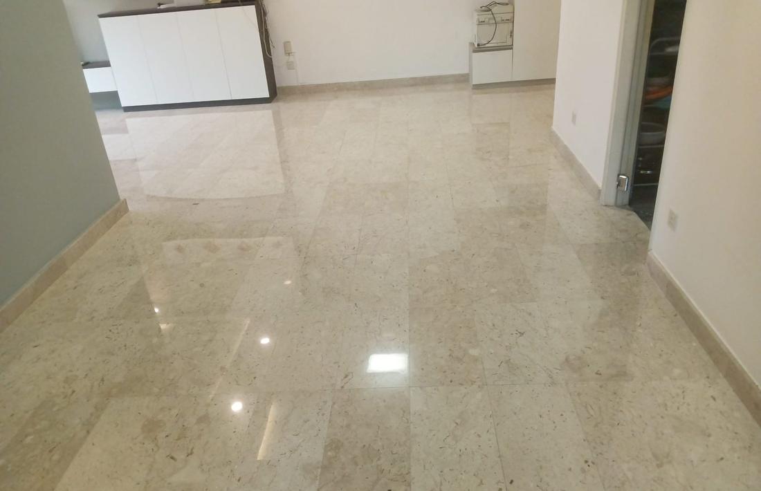 Light marble living room floor after polishing