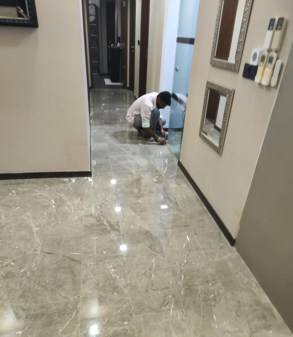 Polishing marble edges near a doorway
