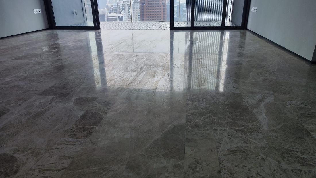 Light reflecting across a marble floor during a shine check