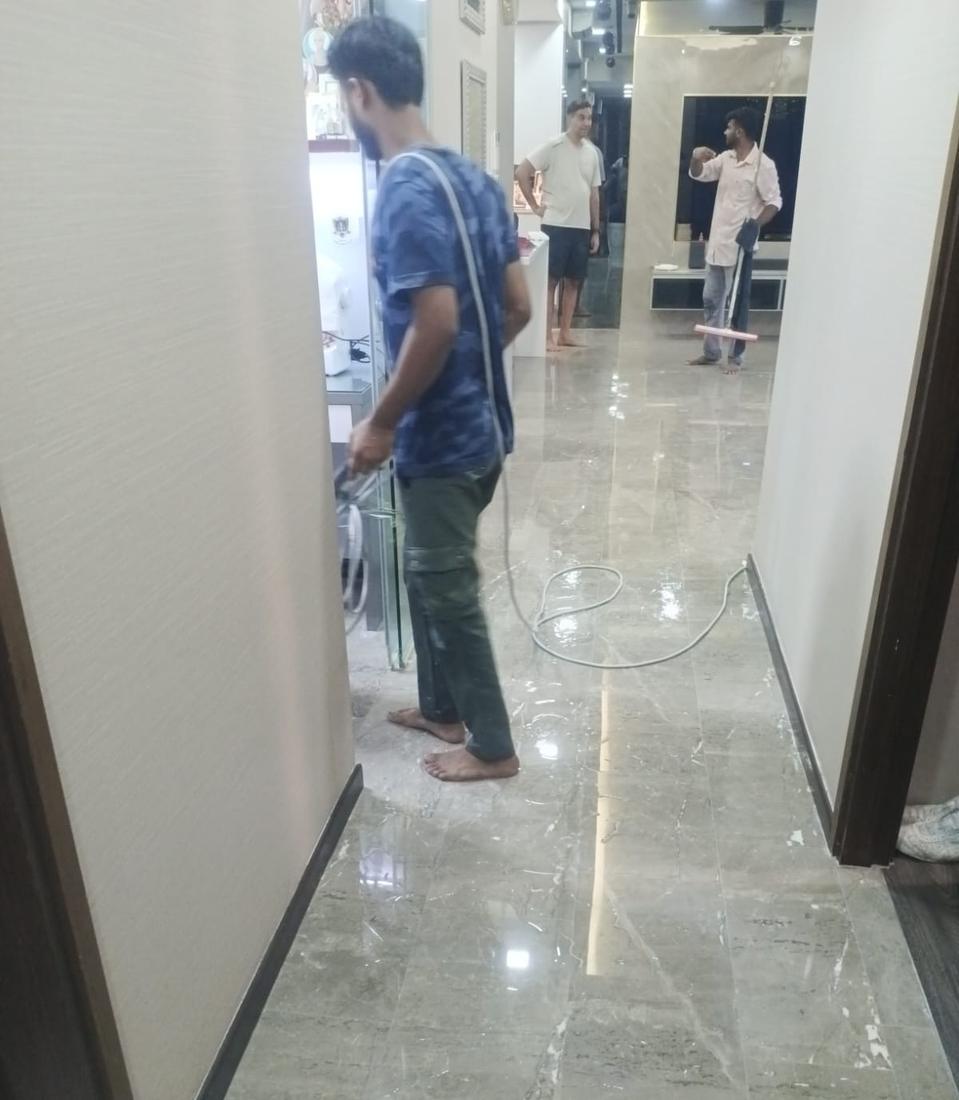 Technician polishing a marble hallway