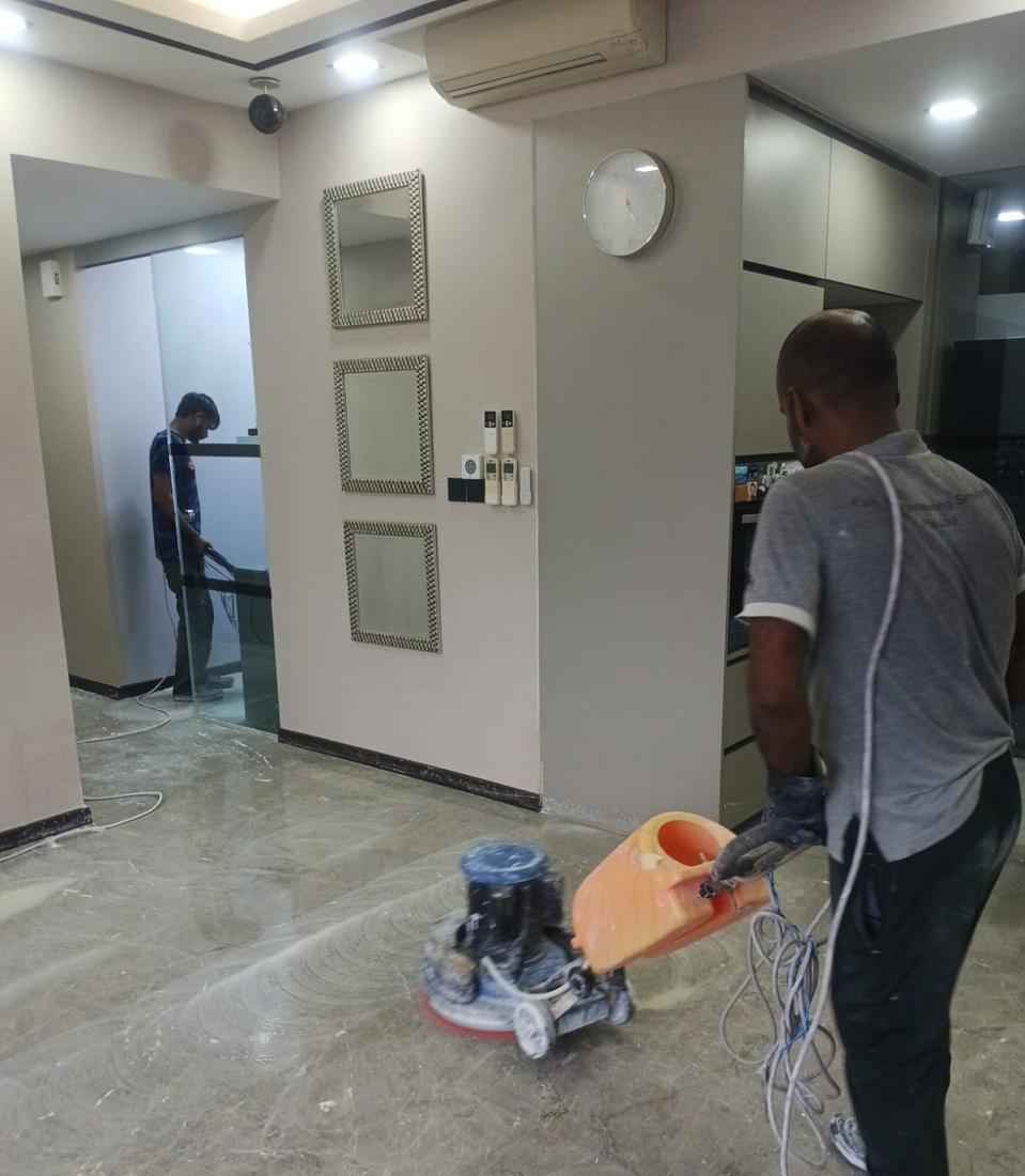 Technician polishing marble with a floor machine